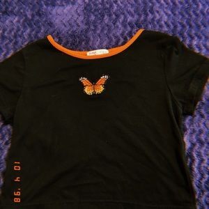 butterfly cropped shirt.